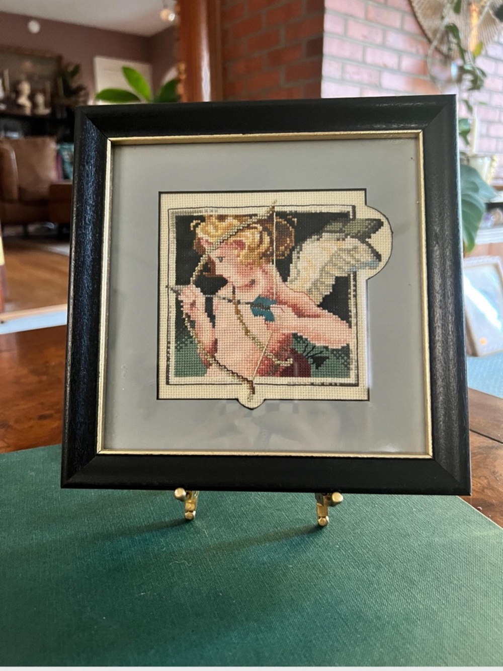 Framed Needlepoint Cherub Artwork in Black Frame